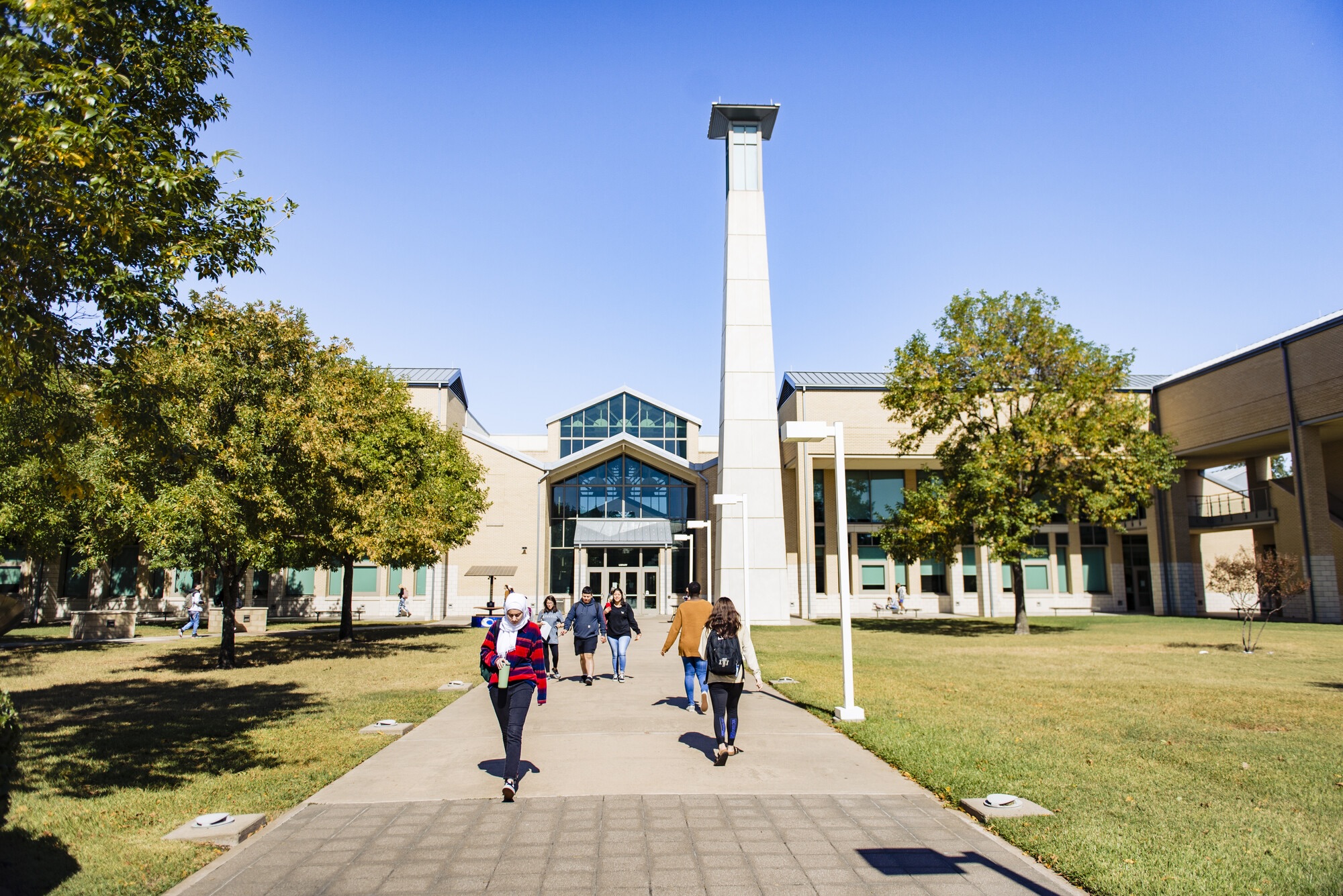 students in front of building